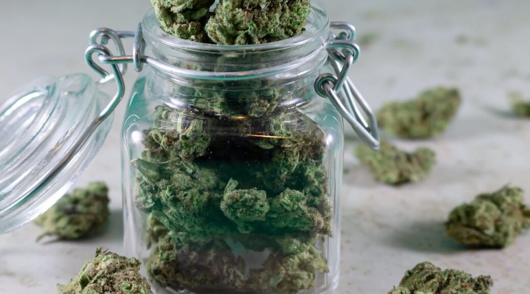 a stash jar filled with cannabis flower